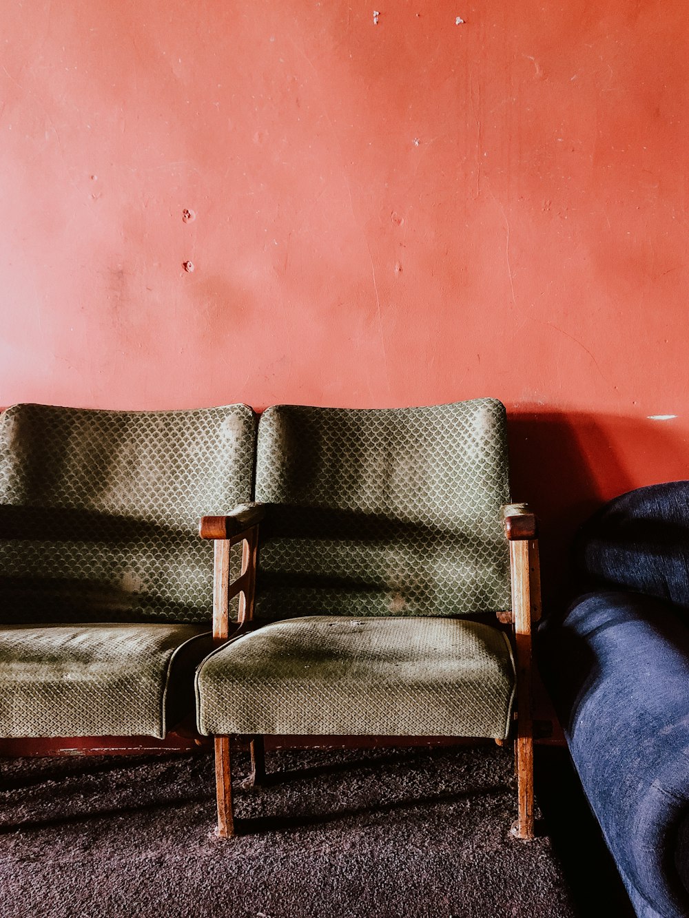 blue and brown padded armchair