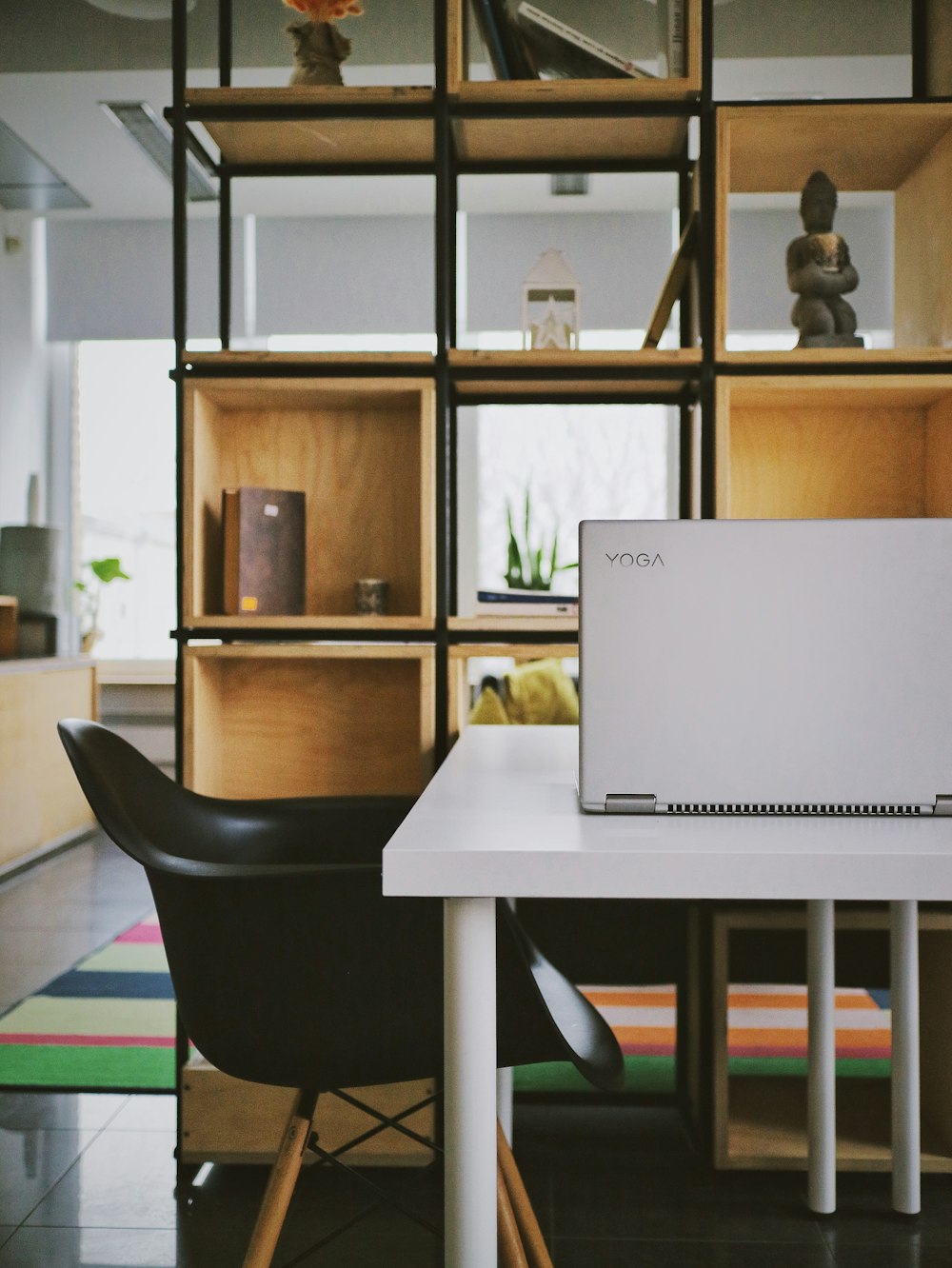 white laptop computer on white table