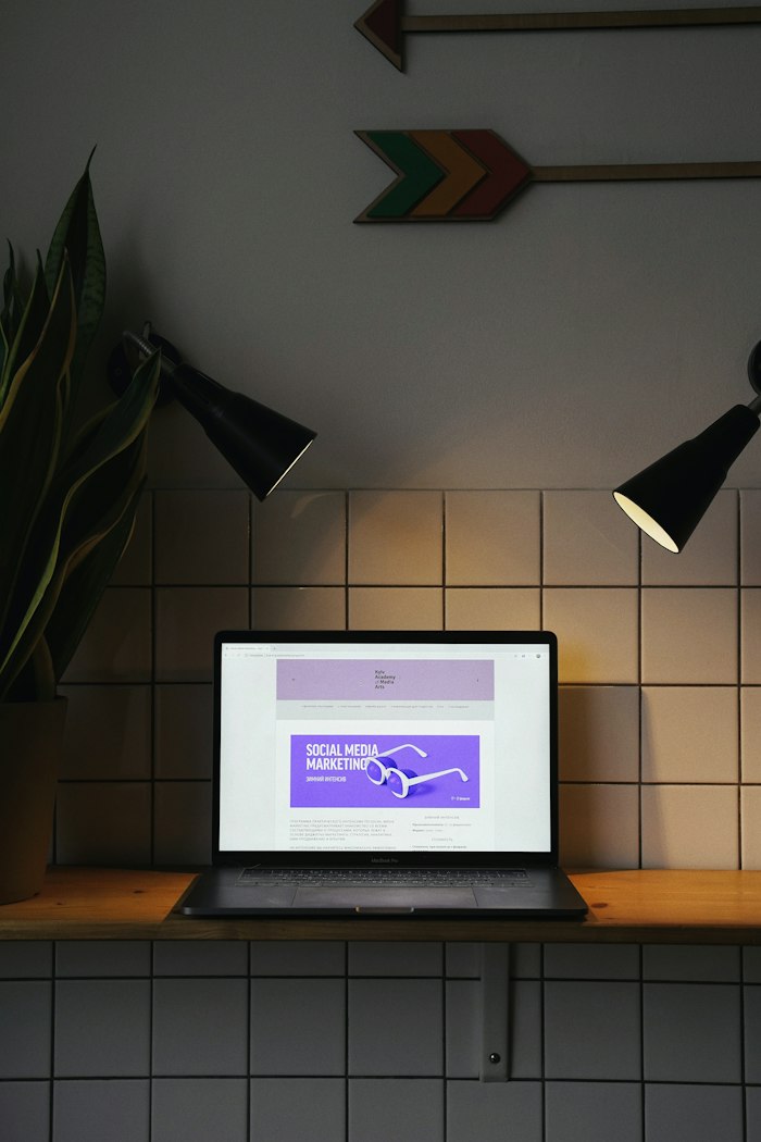 Laptop screen showing a purple advertising banner