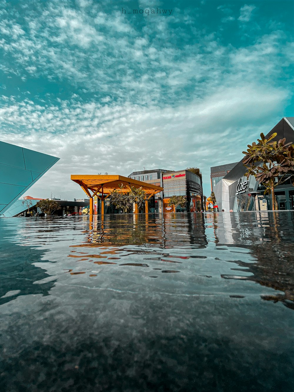 a large building sitting on top of a body of water