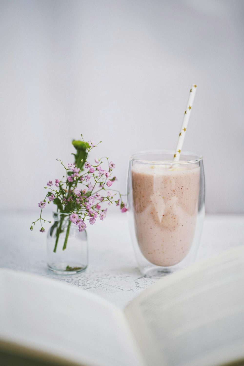 clear drinking glass with brown liquid