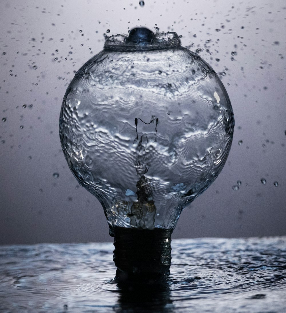 clear glass ball on water