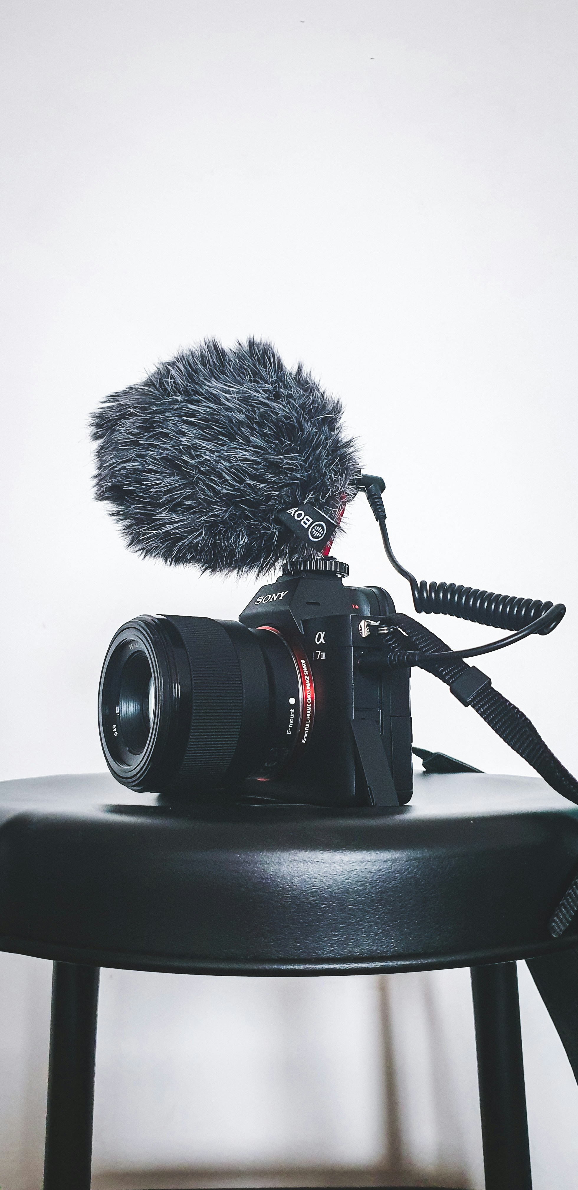black nikon dslr camera on white table