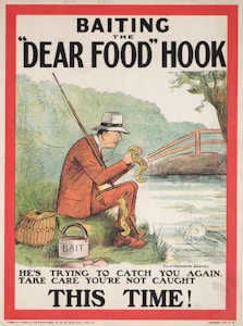 A man in a suit is sitting by a riverbank, holding a fishing rod. The fishing line is baited with what appears to be a corn on the cob labeled 'Protection' and 'Bait.' The man's clothing has various labels, and he is wearing a fedora. There is a bucket beside him labeled 'Bait.' In the water, a face is visible, observing the scene. In the background, there is greenery and a wooden bridge.