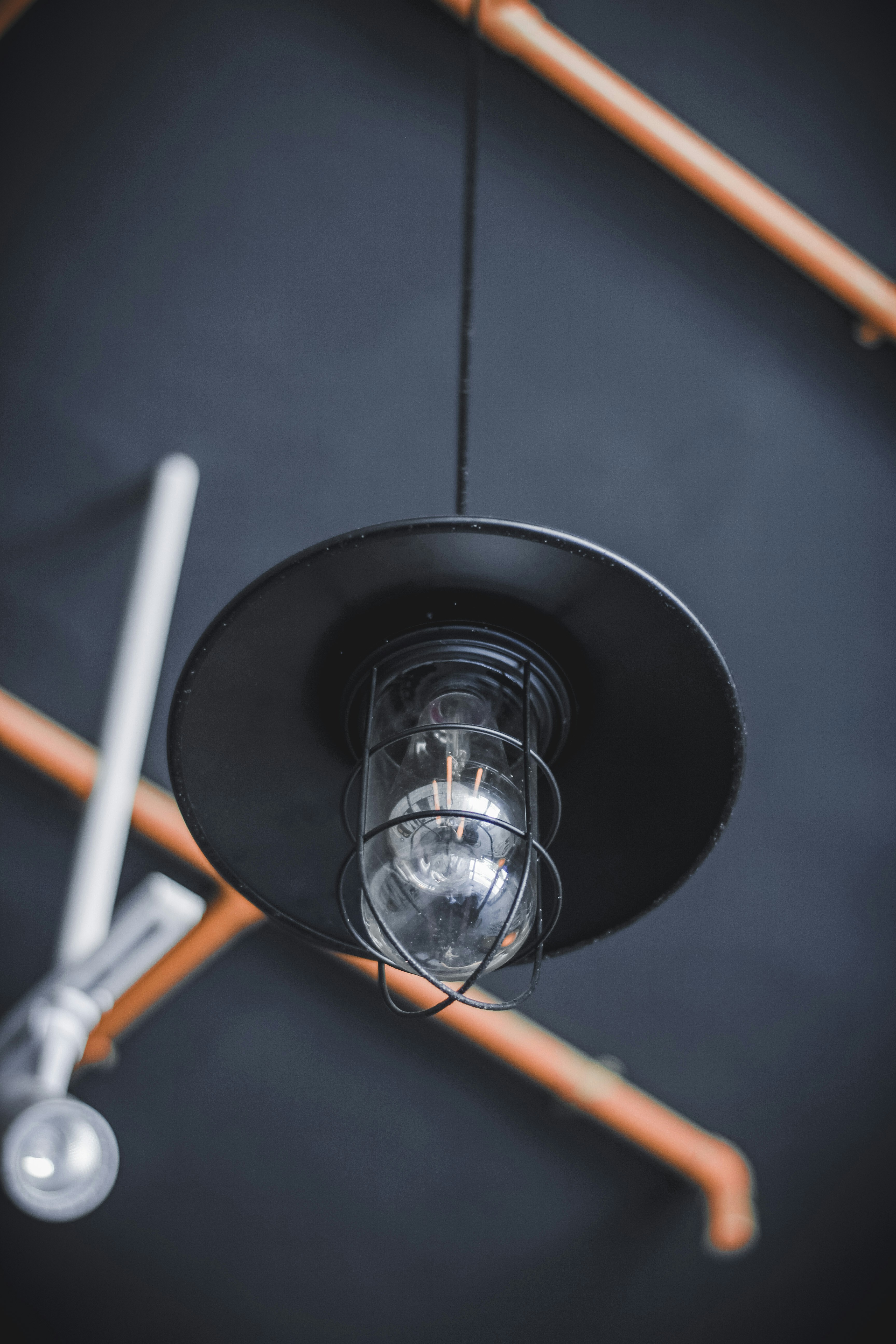 A light that is hanging from a ceiling photo – Free Grey Image on