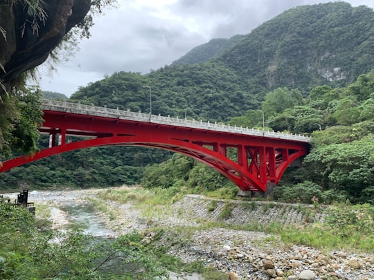 red metal bridge over the river in Taroko National Park Taiwan