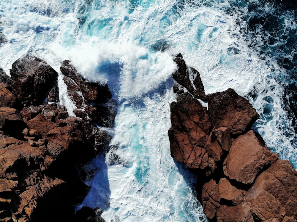 brown rocky mountain with white clouds