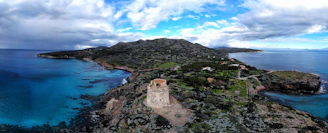 brown concrete building on top of mountain