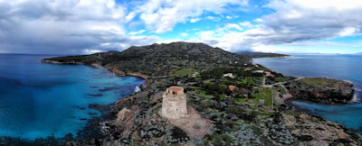 brown concrete building on top of mountain