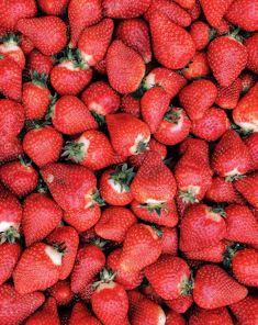 red strawberries on white ceramic plate