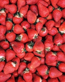 red strawberries on white ceramic plate