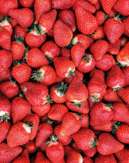 red strawberries on white ceramic plate