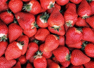 red strawberries on white ceramic plate