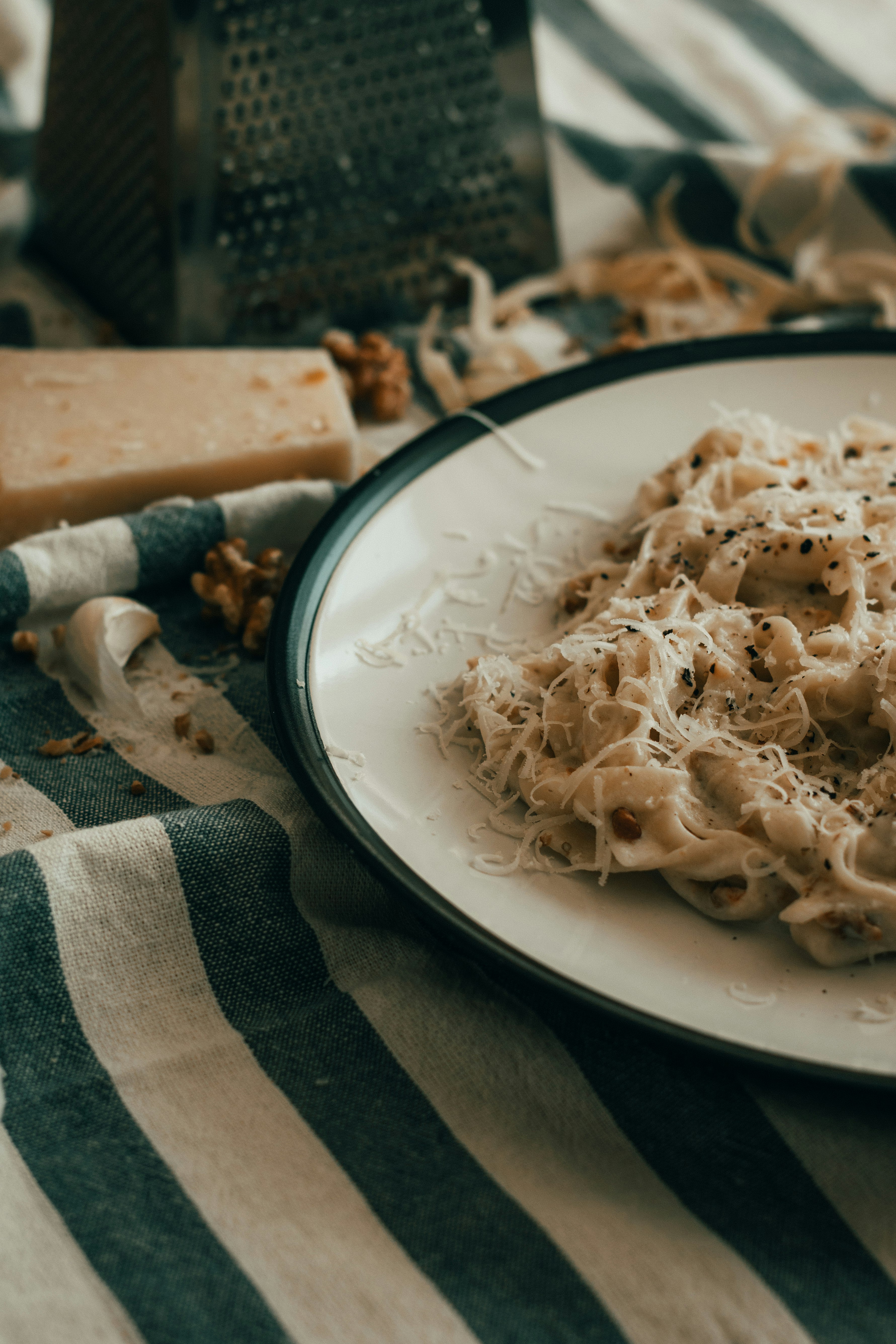 pasta dish on white and black ceramic plate