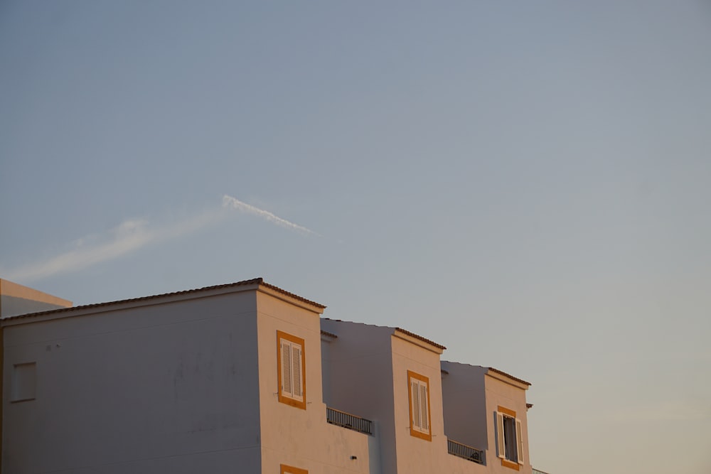 beige concrete building under blue sky during daytime