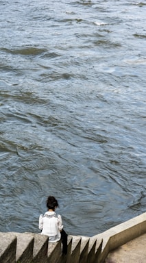 negative space for photo composition,how to photograph the chaos of the world and the calm of a book; person in water during daytime