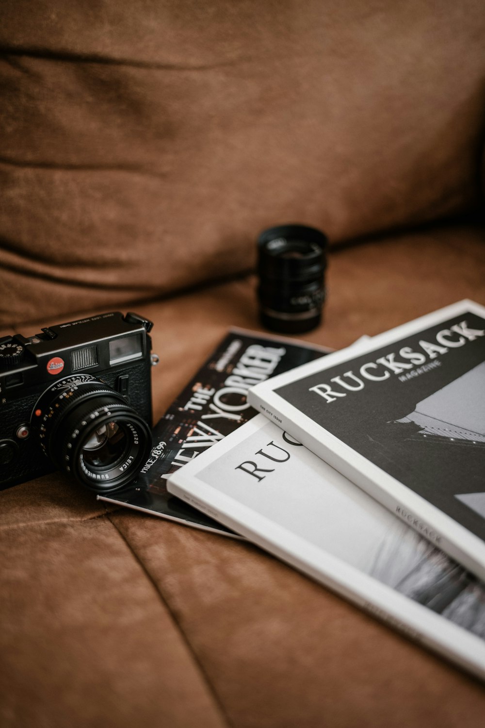 black and white camera lens on white book