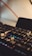 A close-up of a modern mechanical keyboard with backlit keys on a minimalist desk.