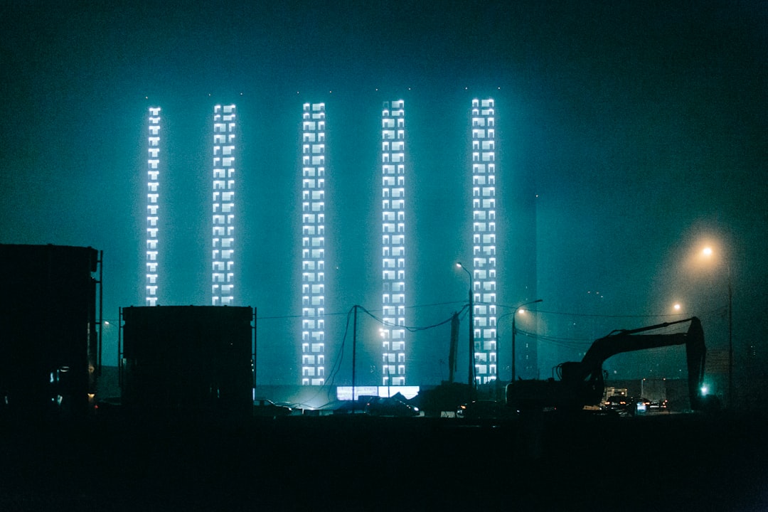 silhouette of people standing near stage