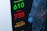The image displays a digital screen with COVID-19 statistics, including the numbers of recovered, deaths, and suspected cases. A map with blue circular markers is visible on the right side, indicating different locations.