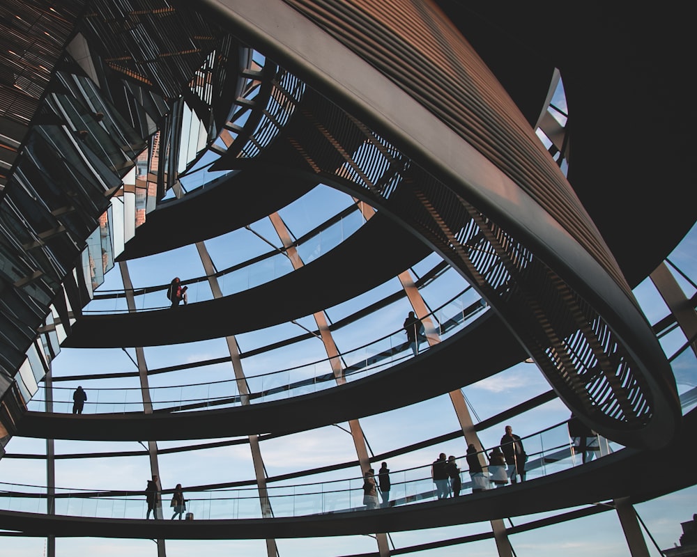 people walking on spiral staircase