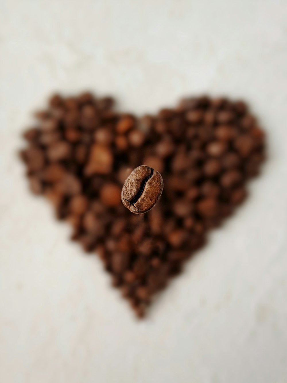 silver heart ring on brown heart shaped textile