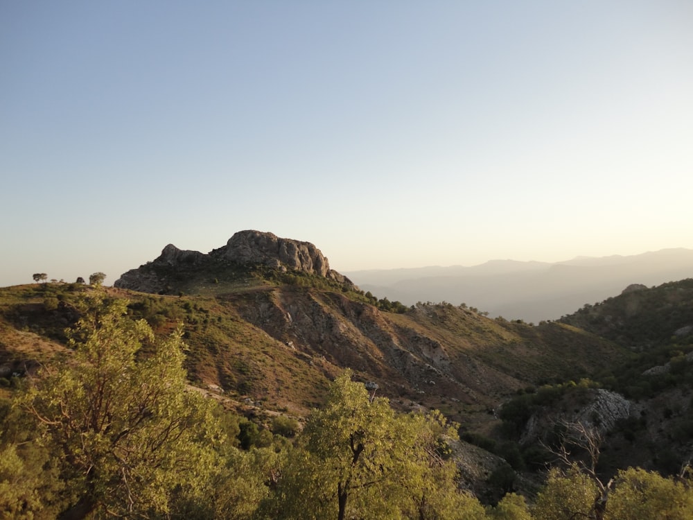 green and brown mountain under blue sky during daytime