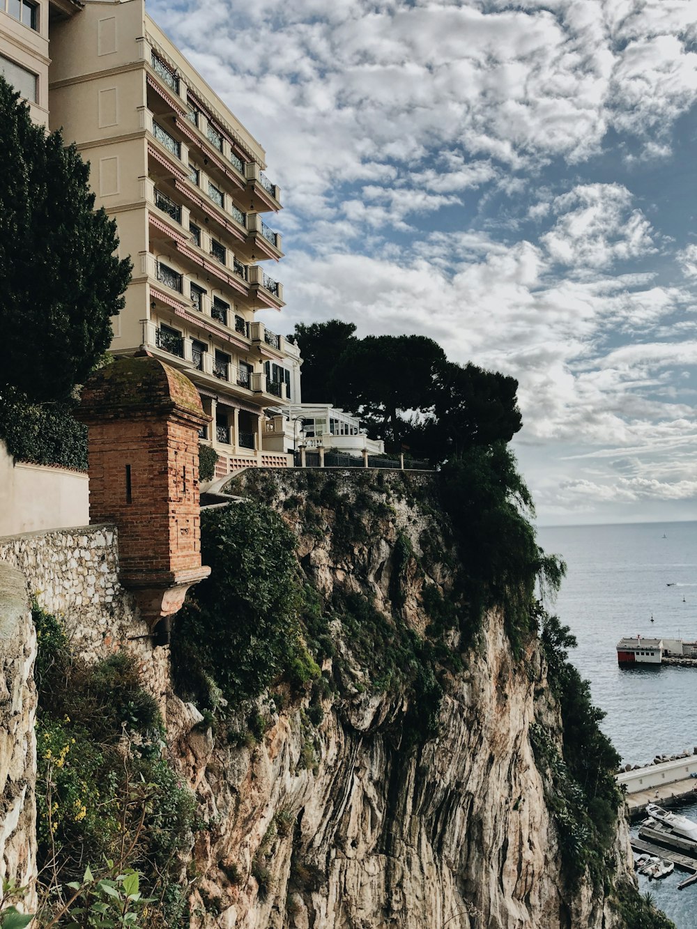 brown concrete building near body of water during daytime