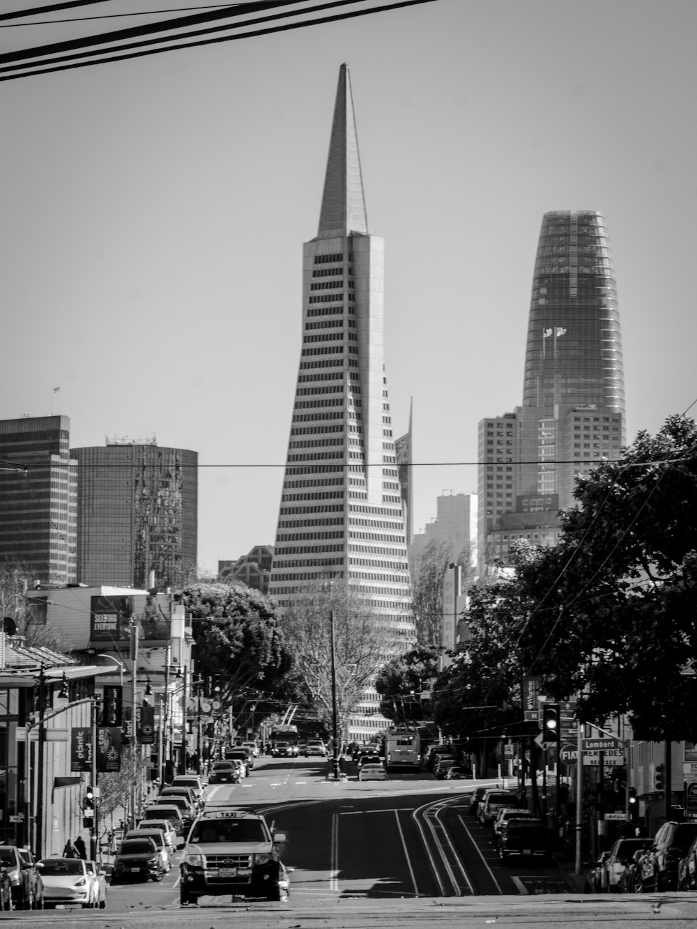 grayscale photo of city buildings