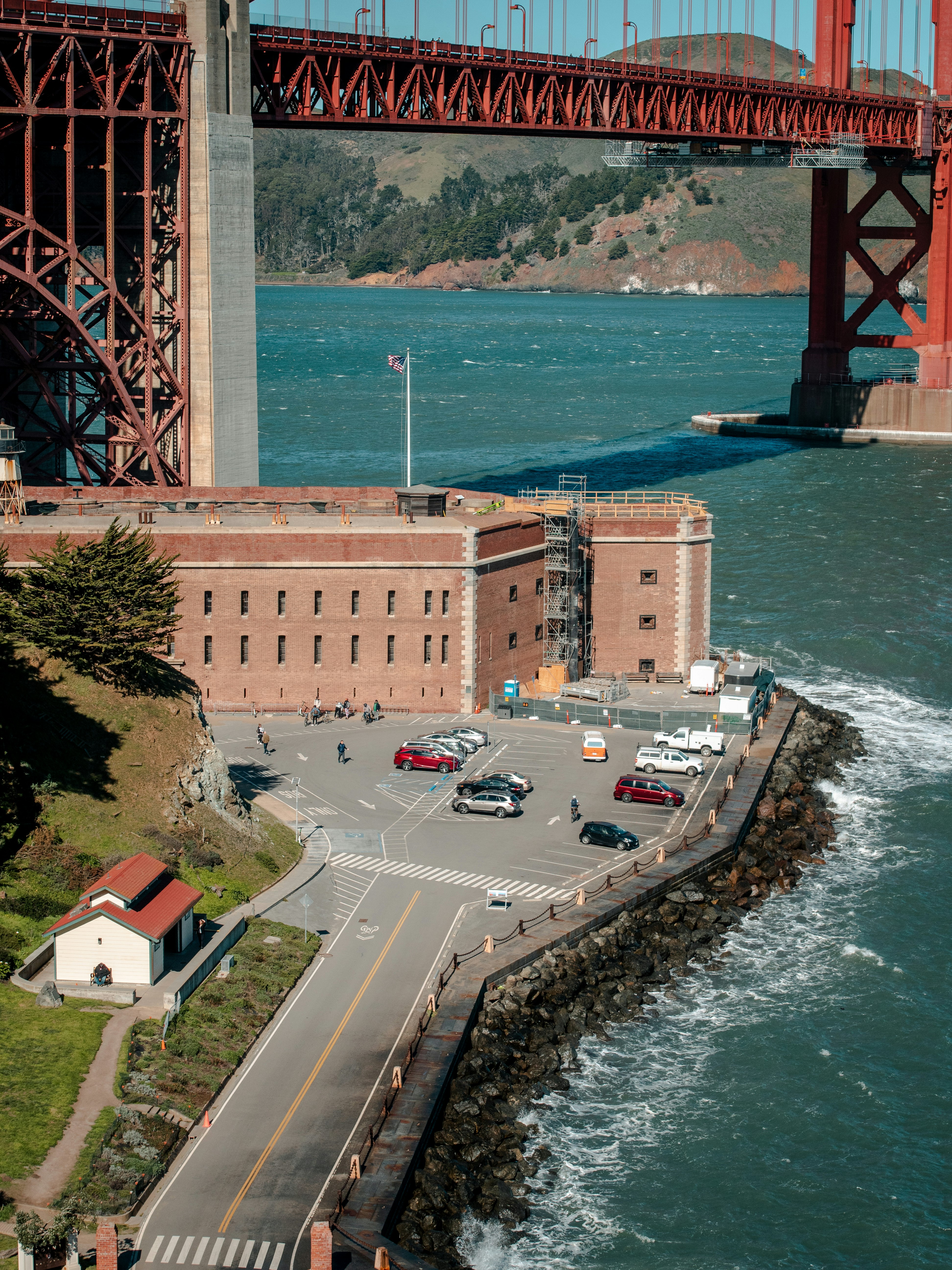 cars on road near bridge during daytime