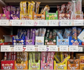 Variety of Asian snacks and spices showcased in vibrant packaging.