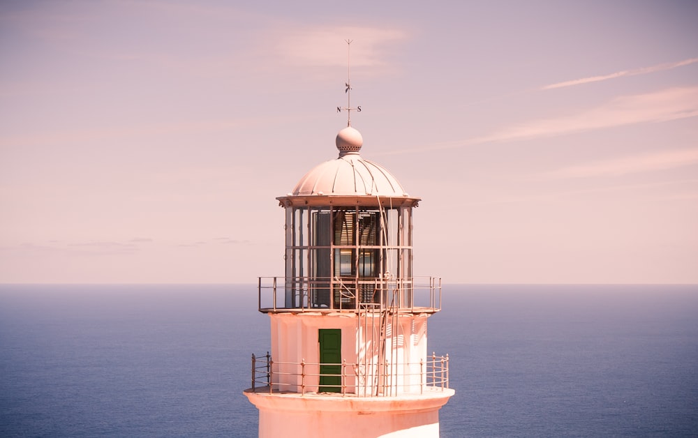 white and brown concrete building on sea during daytime