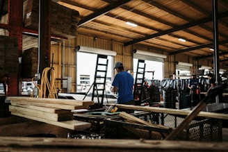 man in blue shirt standing in front of man in blue shirt