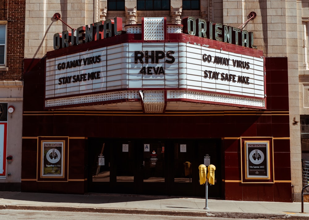 a theater marquee with a parking meter in front of it