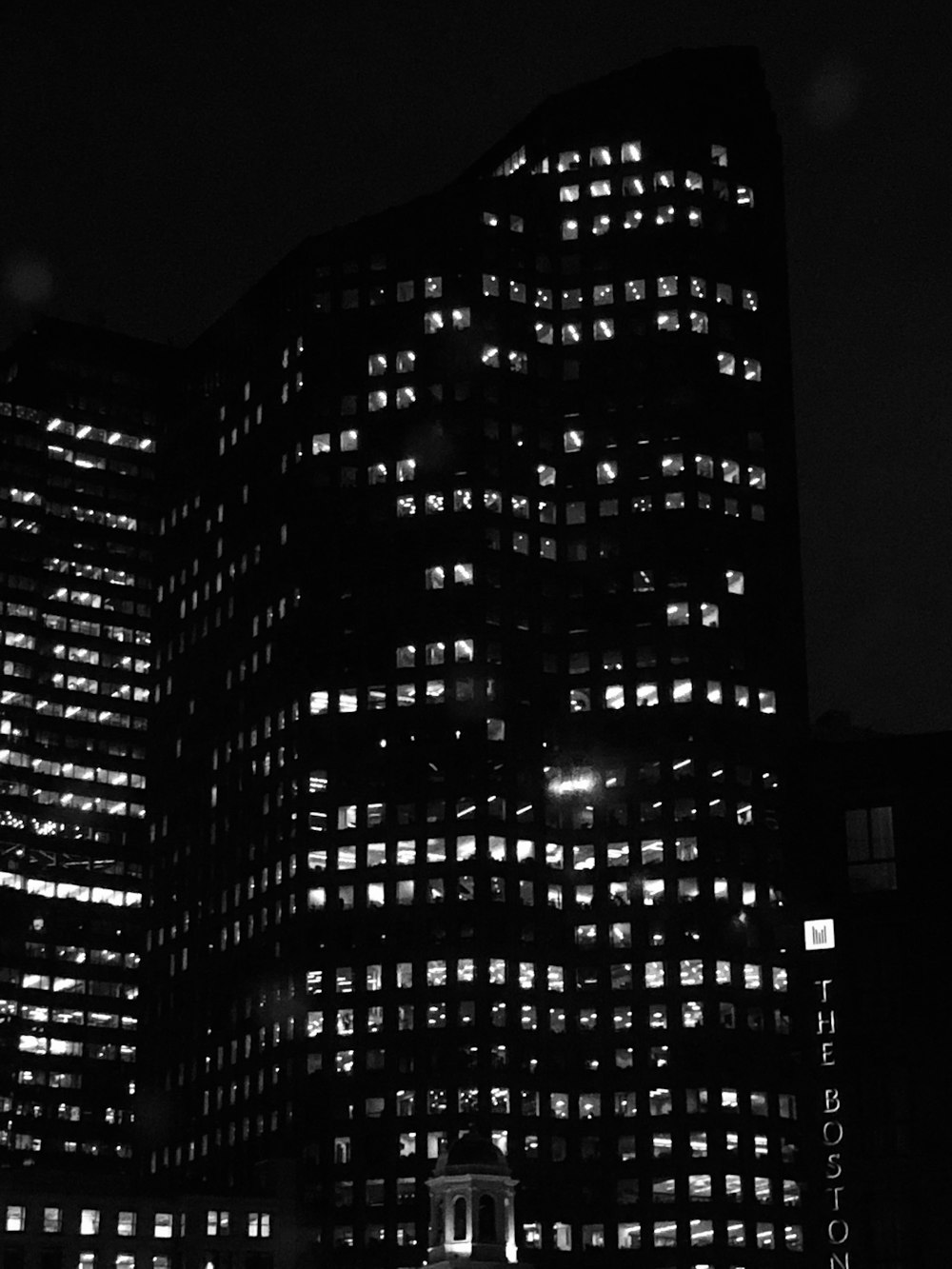 grayscale photo of high rise building