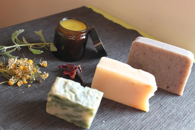 cheese and green leaves on brown wooden table