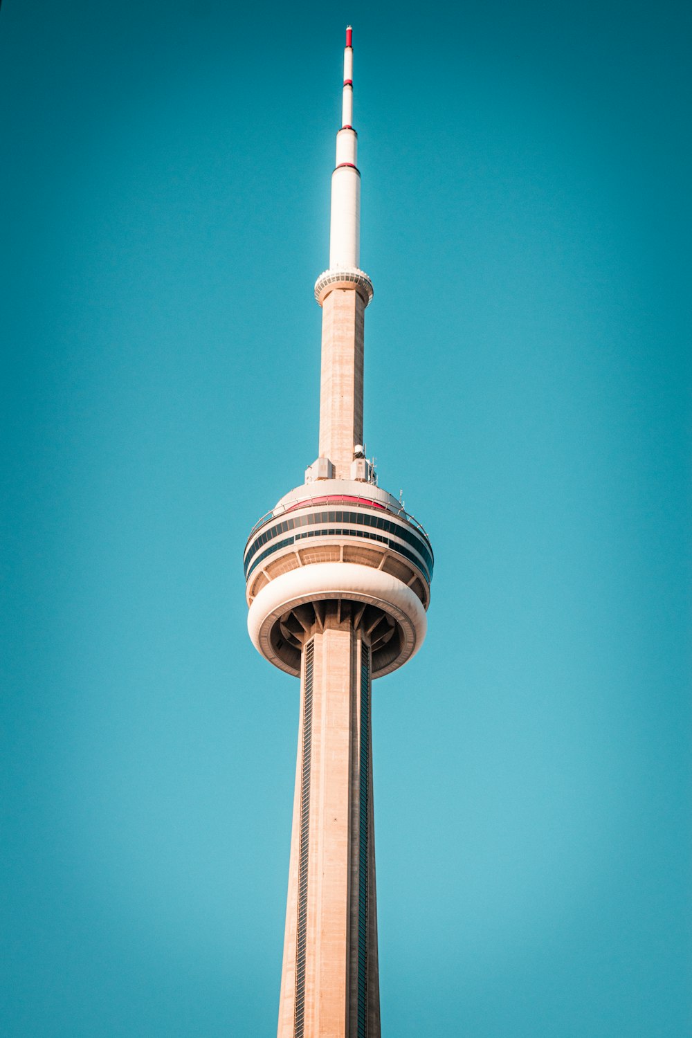 white and brown concrete tower under blue sky during daytime