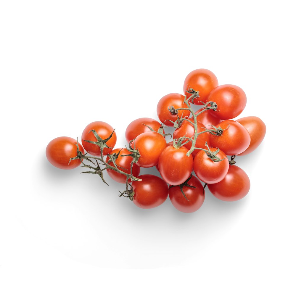 red tomatoes on white background