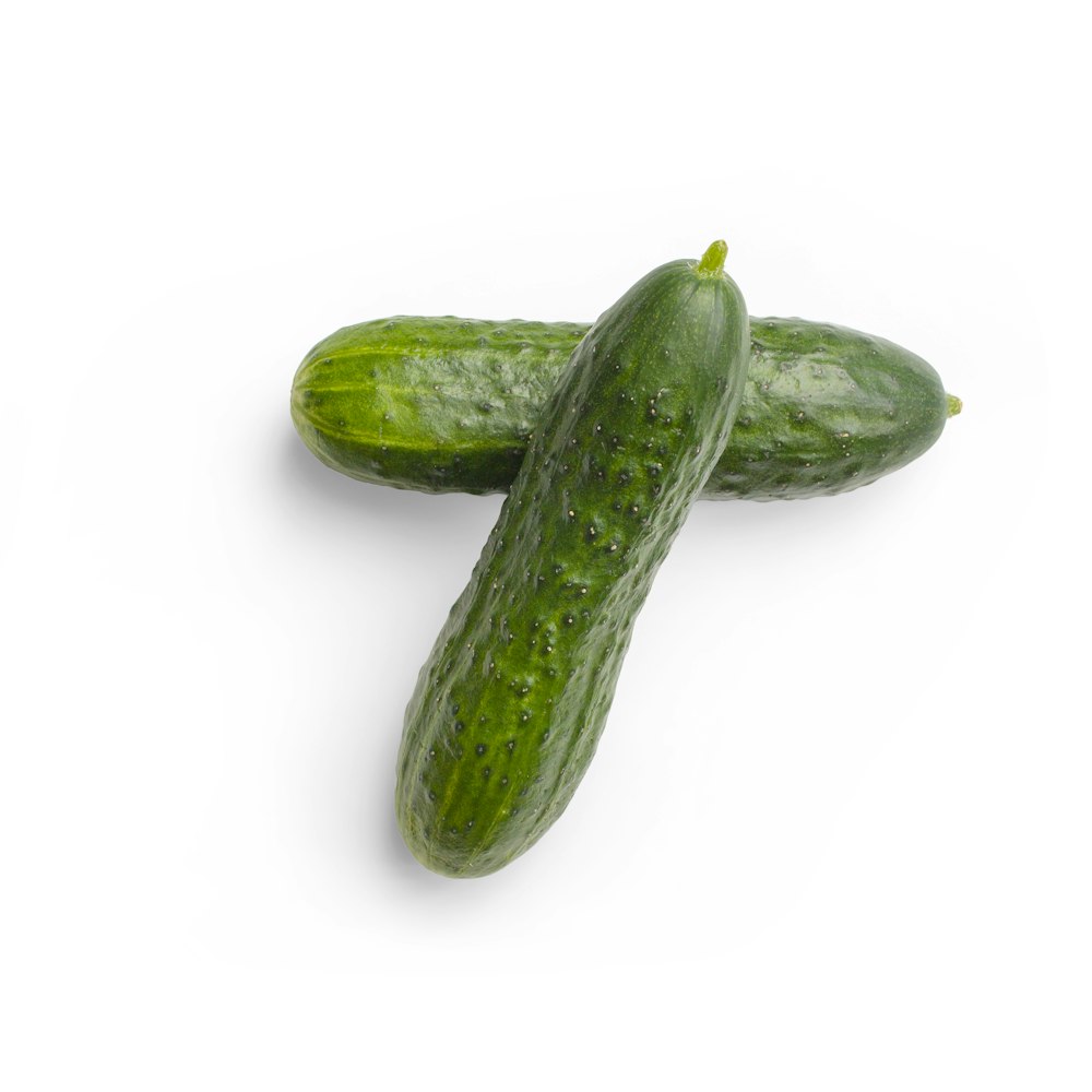 green cucumber on white surface