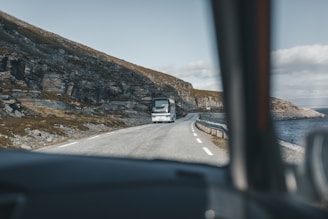 A picturesque bus route along a coastal road.