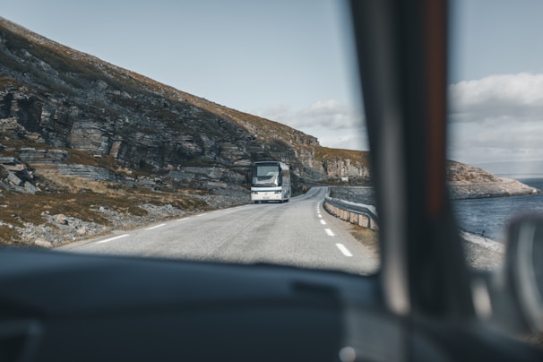 A picturesque bus route along a coastal road.