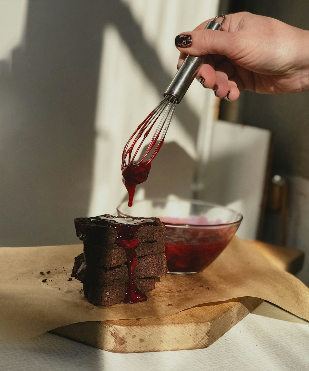 person holding stainless steel fork and knife