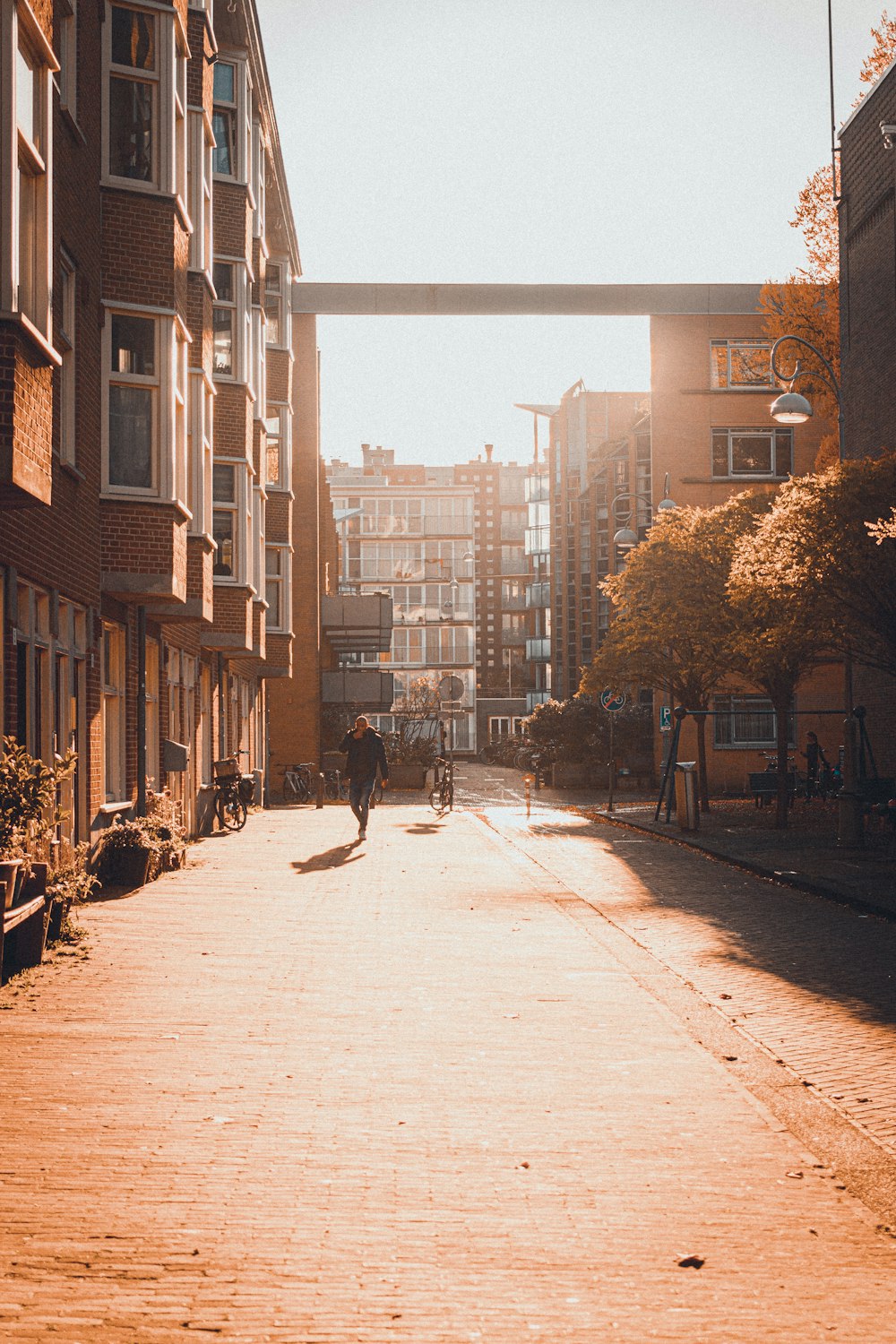 people walking on sidewalk near buildings during daytime