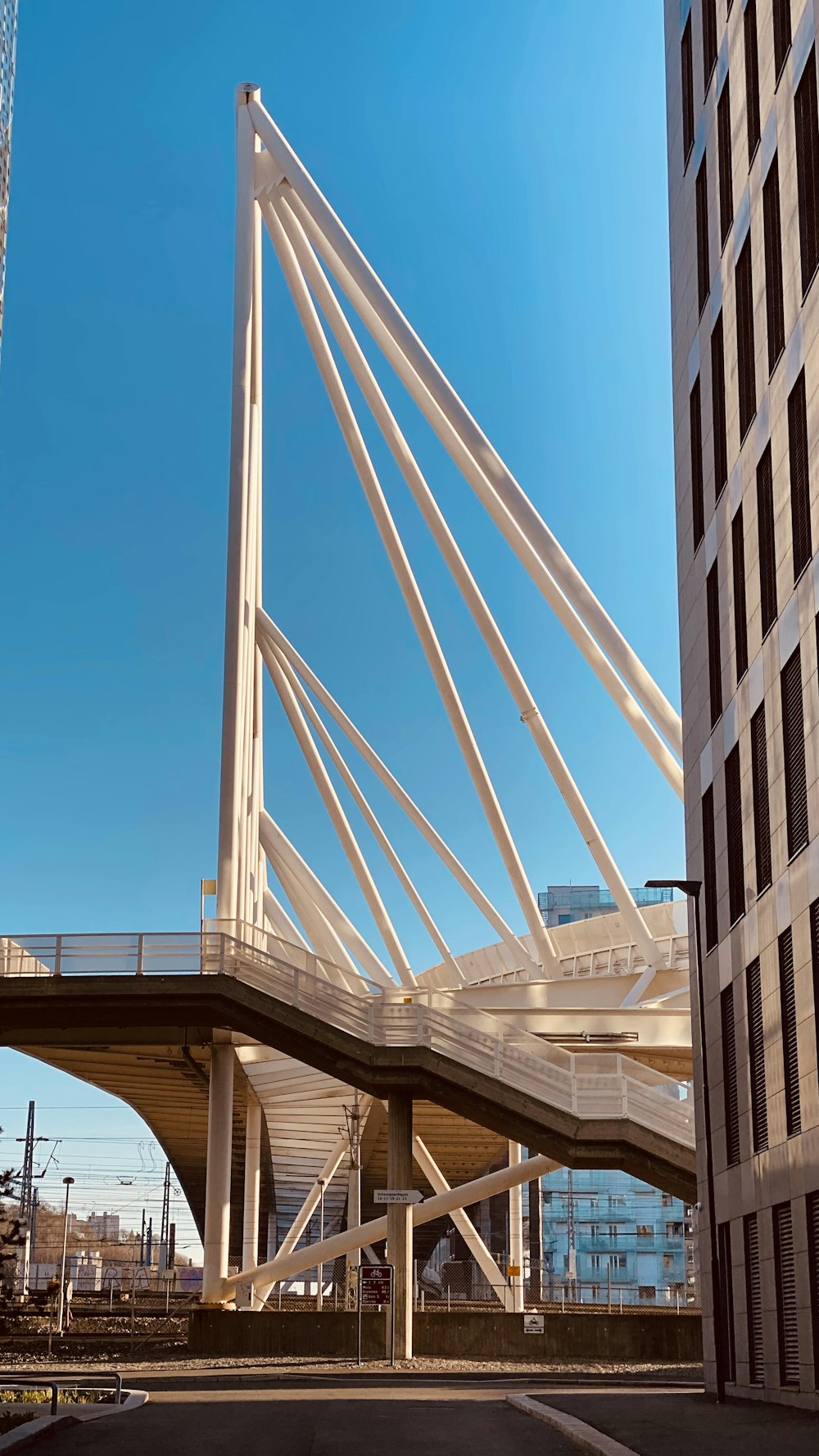 a very tall bridge over a city street