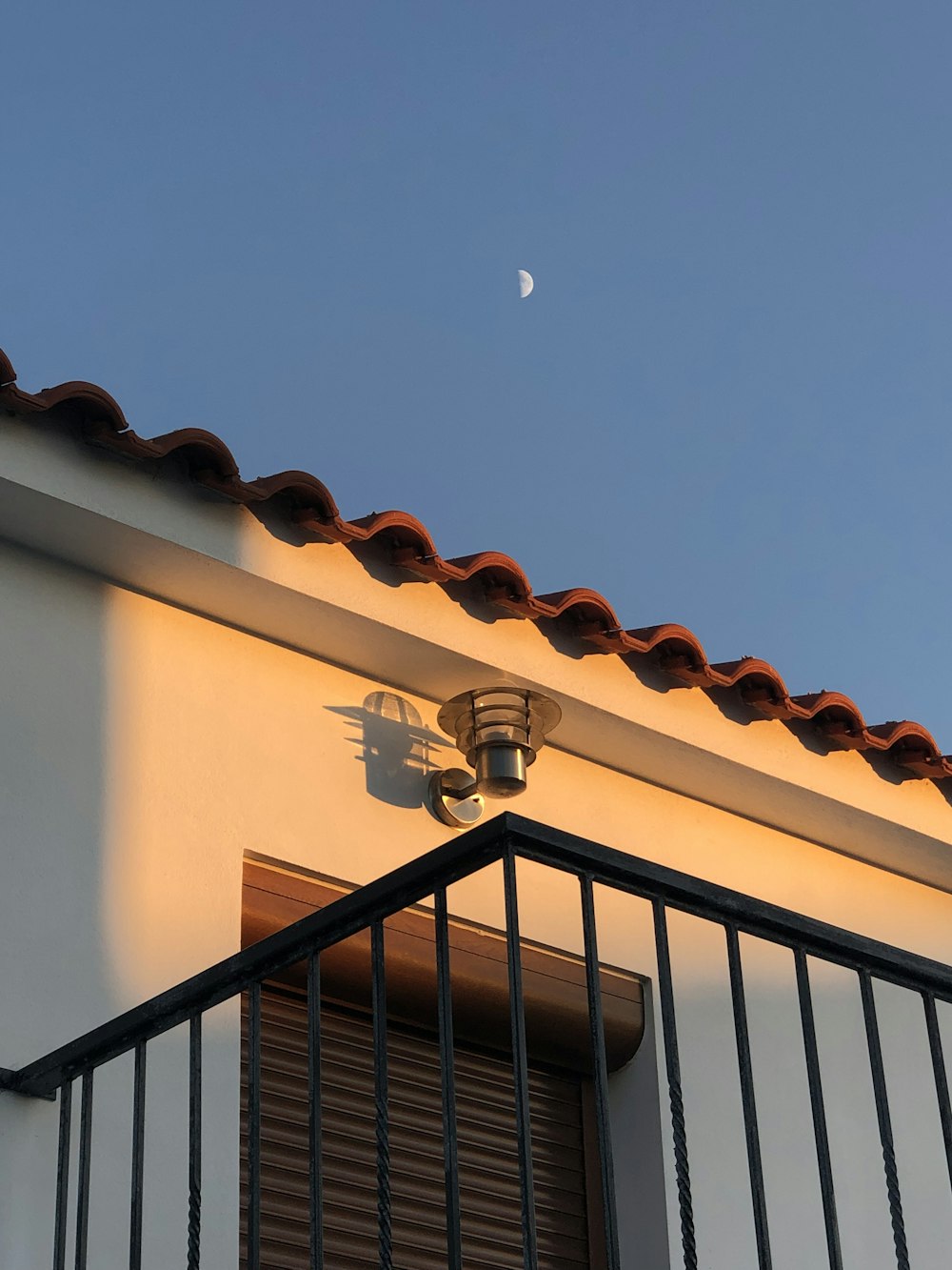 black metal railings under clear blue sky during daytime