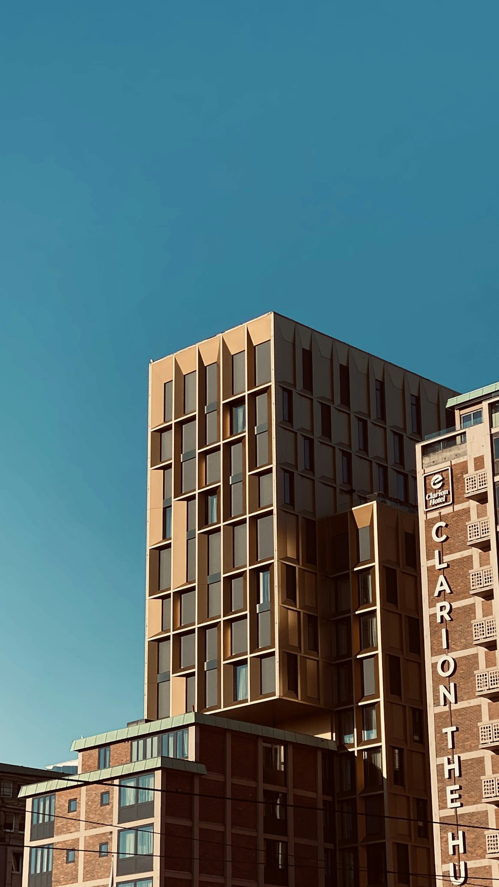 white concrete building under blue sky during daytime