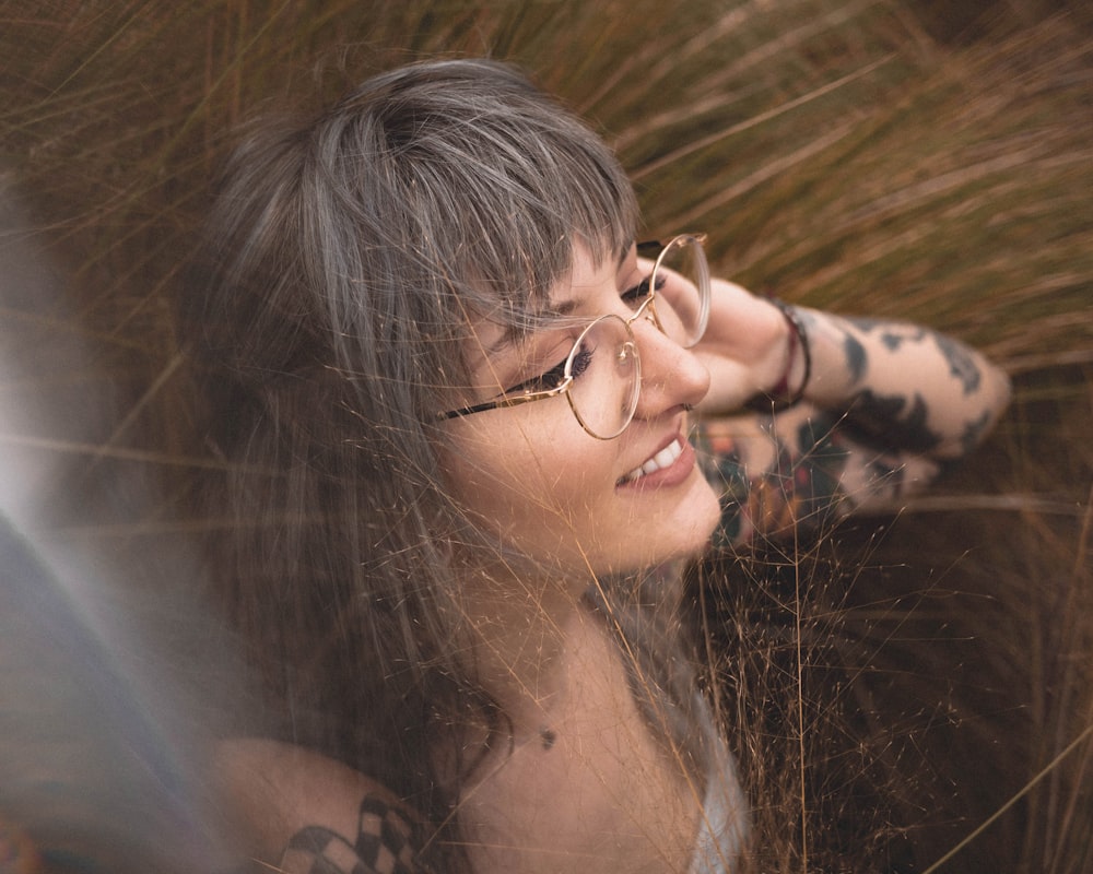 woman in black and brown leopard print shirt wearing eyeglasses