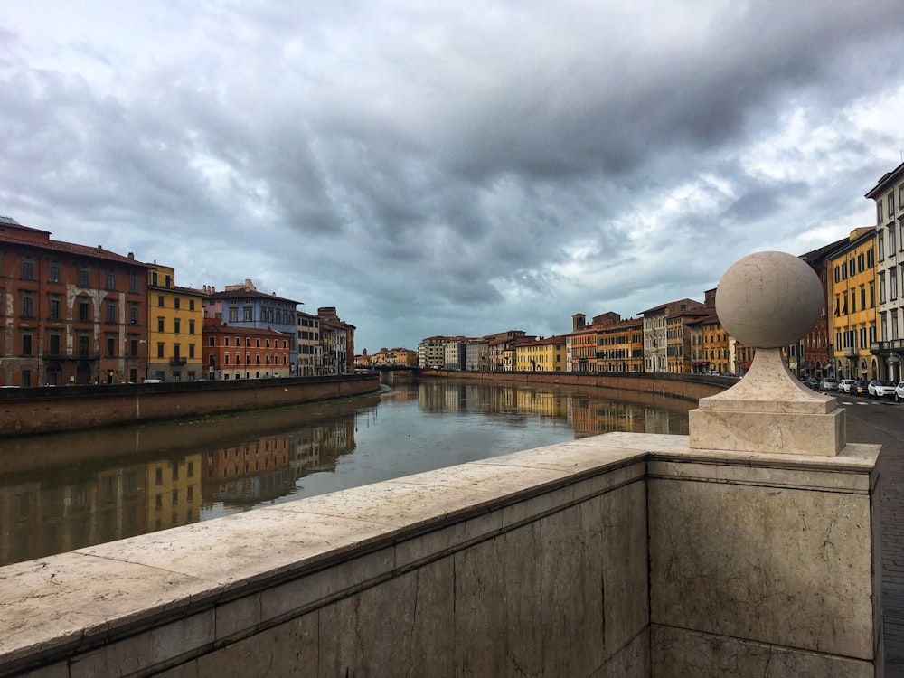 body of water near buildings during daytime