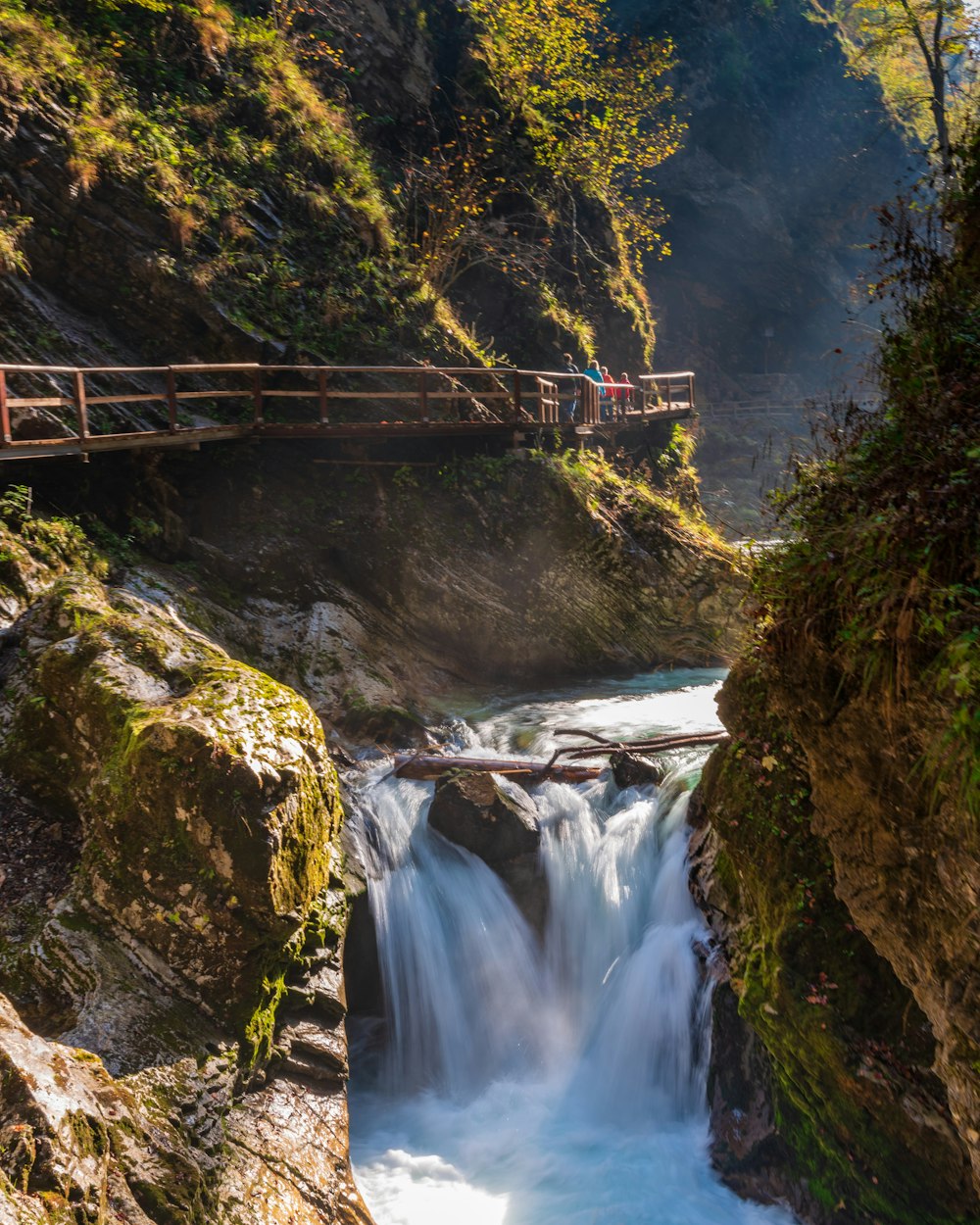 brown wooden bridge over river