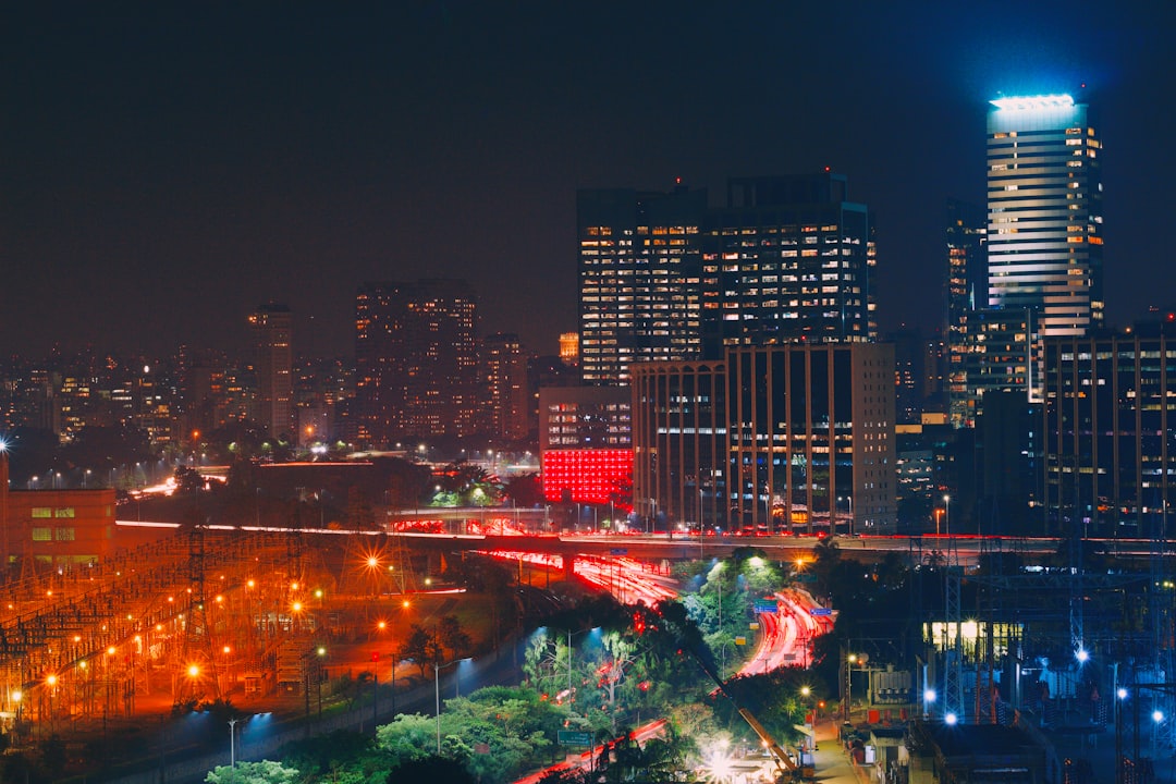 city with high rise buildings during night time